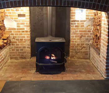 Vermont Intrepid Wood Burner - installation into beautiful period inglenook fireplace in the Surrey Hills, between Guildford and Dorking.